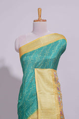 Teal green striped zari design dola silk saree with contrast zari border and floral design blouse