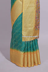 Teal green striped zari design dola silk saree with contrast zari border and floral design blouse