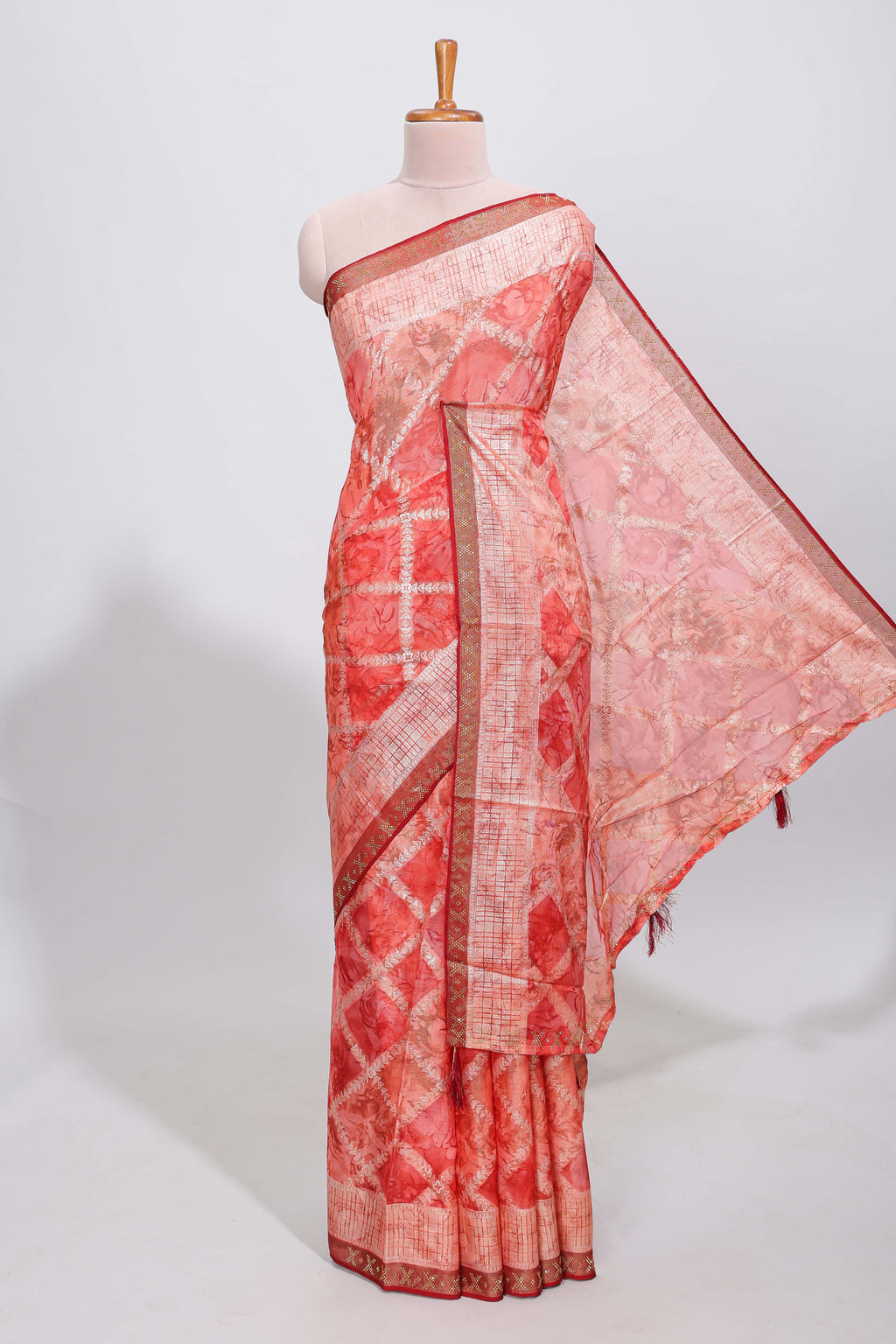 Orange checked floral theme dola silk saree with self border and matching blouse
