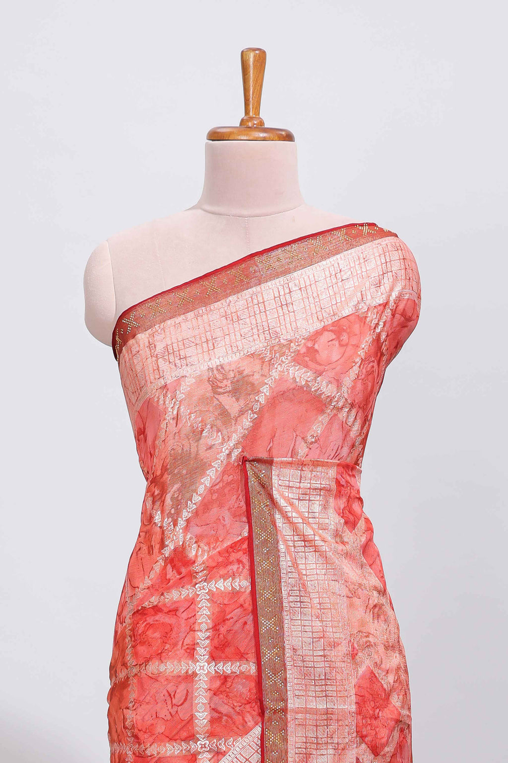 Orange checked floral theme dola silk saree with self border and matching blouse