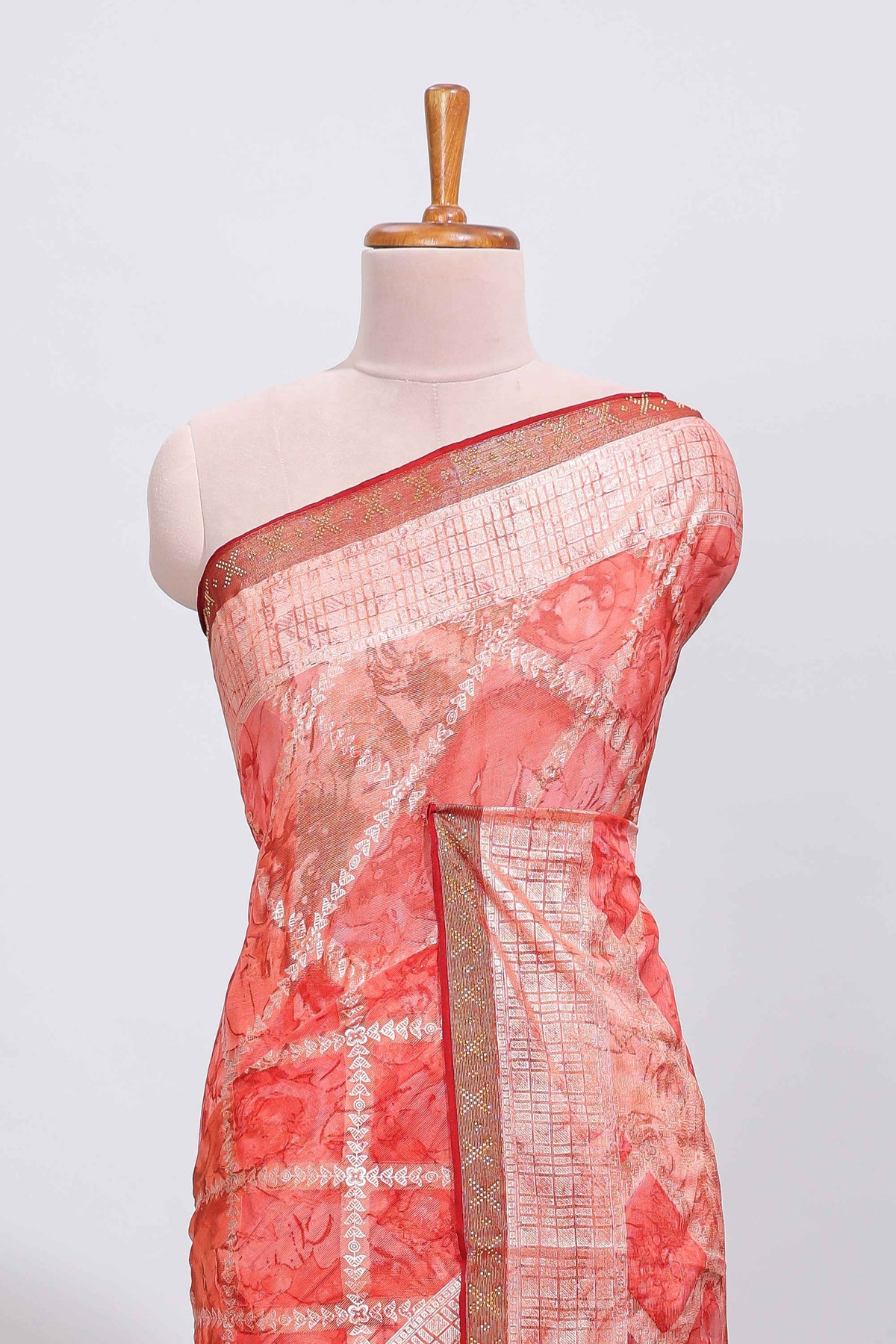 Orange checked floral theme dola silk saree with self border and matching blouse