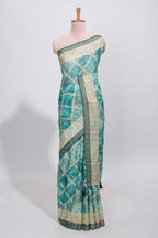 Green checked floral theme dola silk saree with self border and matching blouse