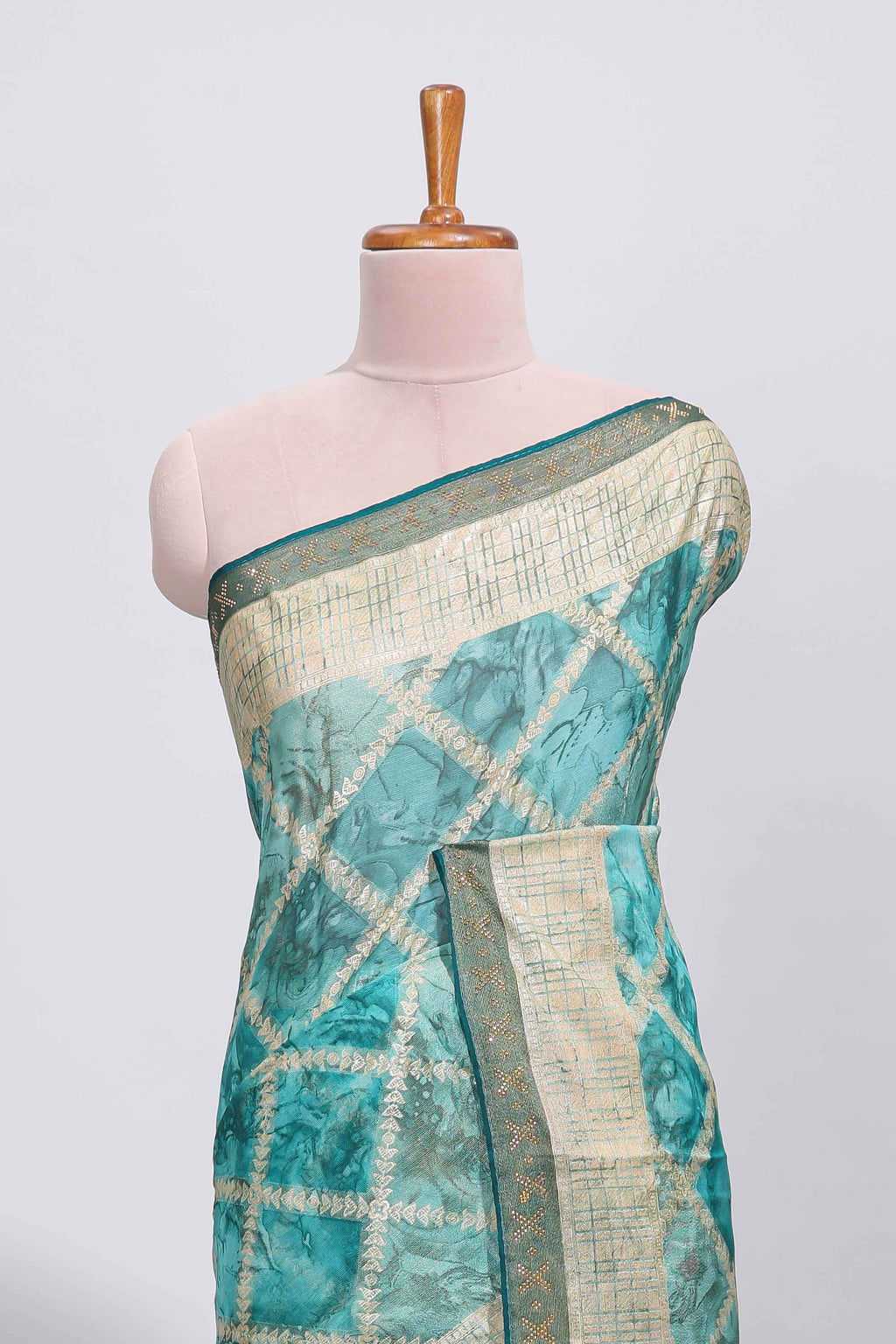 Green checked floral theme dola silk saree with self border and matching blouse