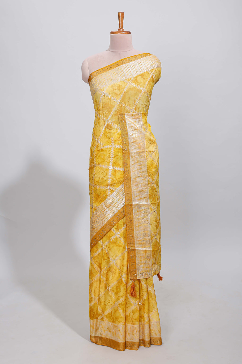 Yellow checked floral theme dola silk saree with self border and matching blouse