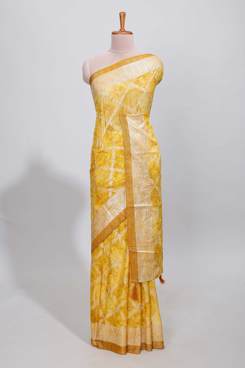 Yellow checked floral theme dola silk saree with self border and matching blouse