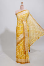 Yellow checked floral theme dola silk saree with self border and matching blouse