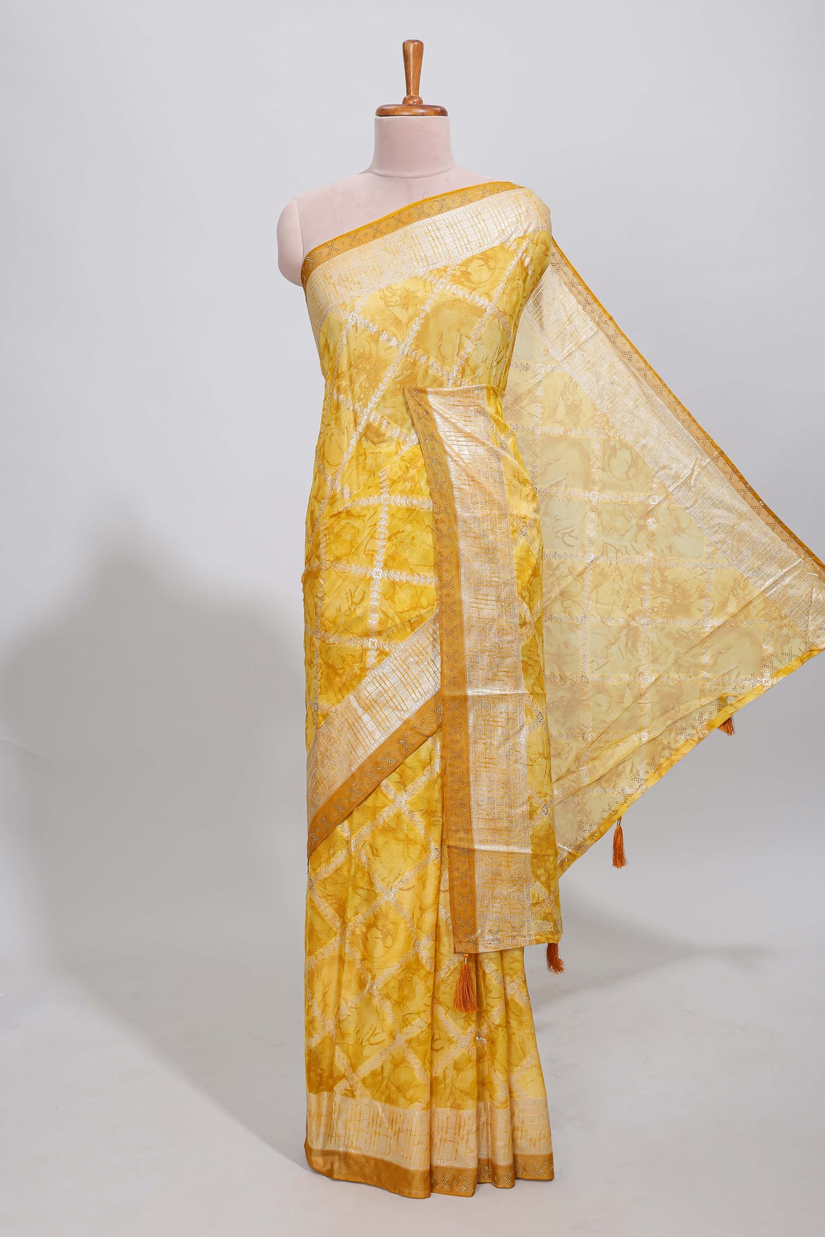 Yellow checked floral theme dola silk saree with self border and matching blouse