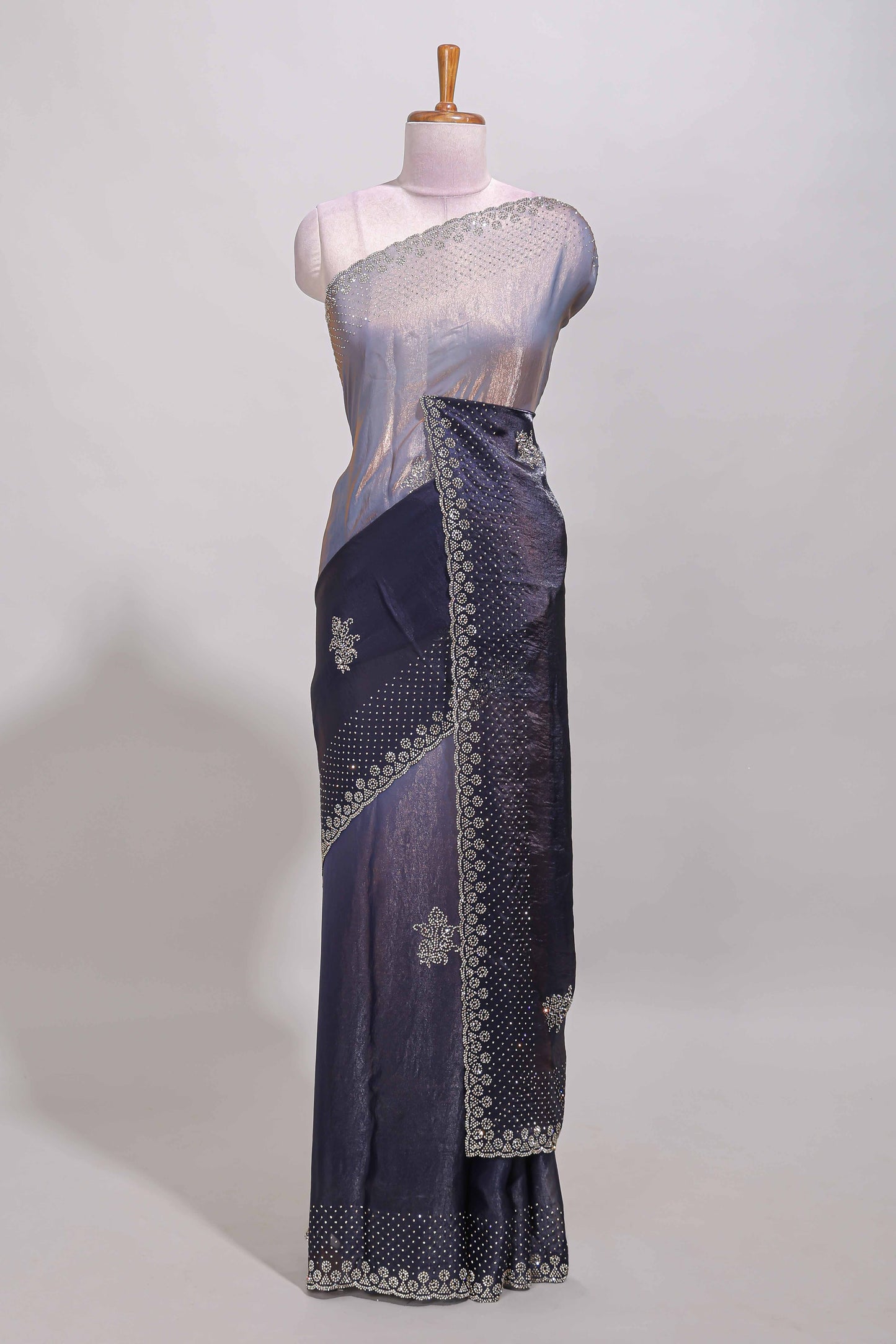 Dual tone navy blue & silver designer saree with floral motifs, stone work & scallop border