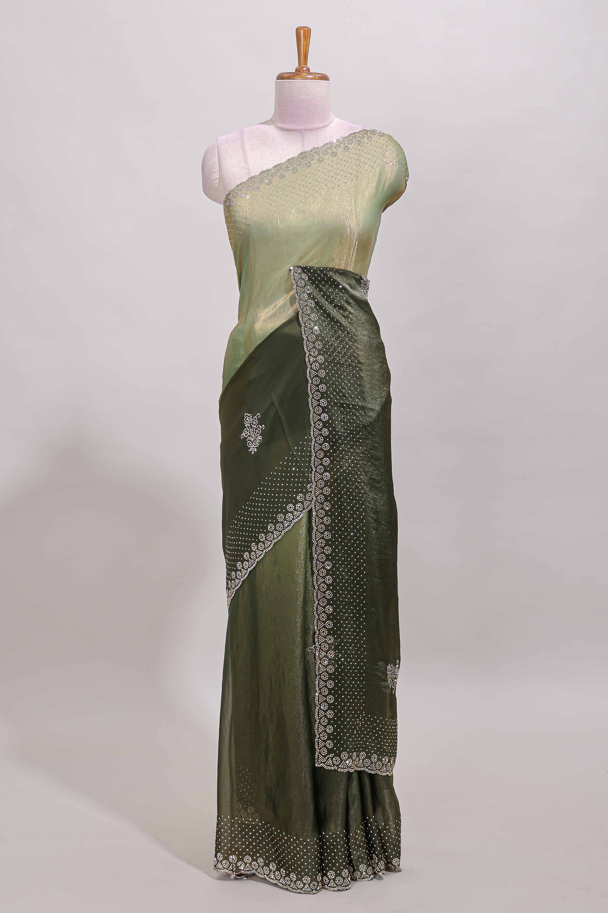 Green dual shade designer saree with floral motifs, stone work & scallop border