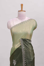 Green dual shade designer saree with floral motifs, stone work & scallop border