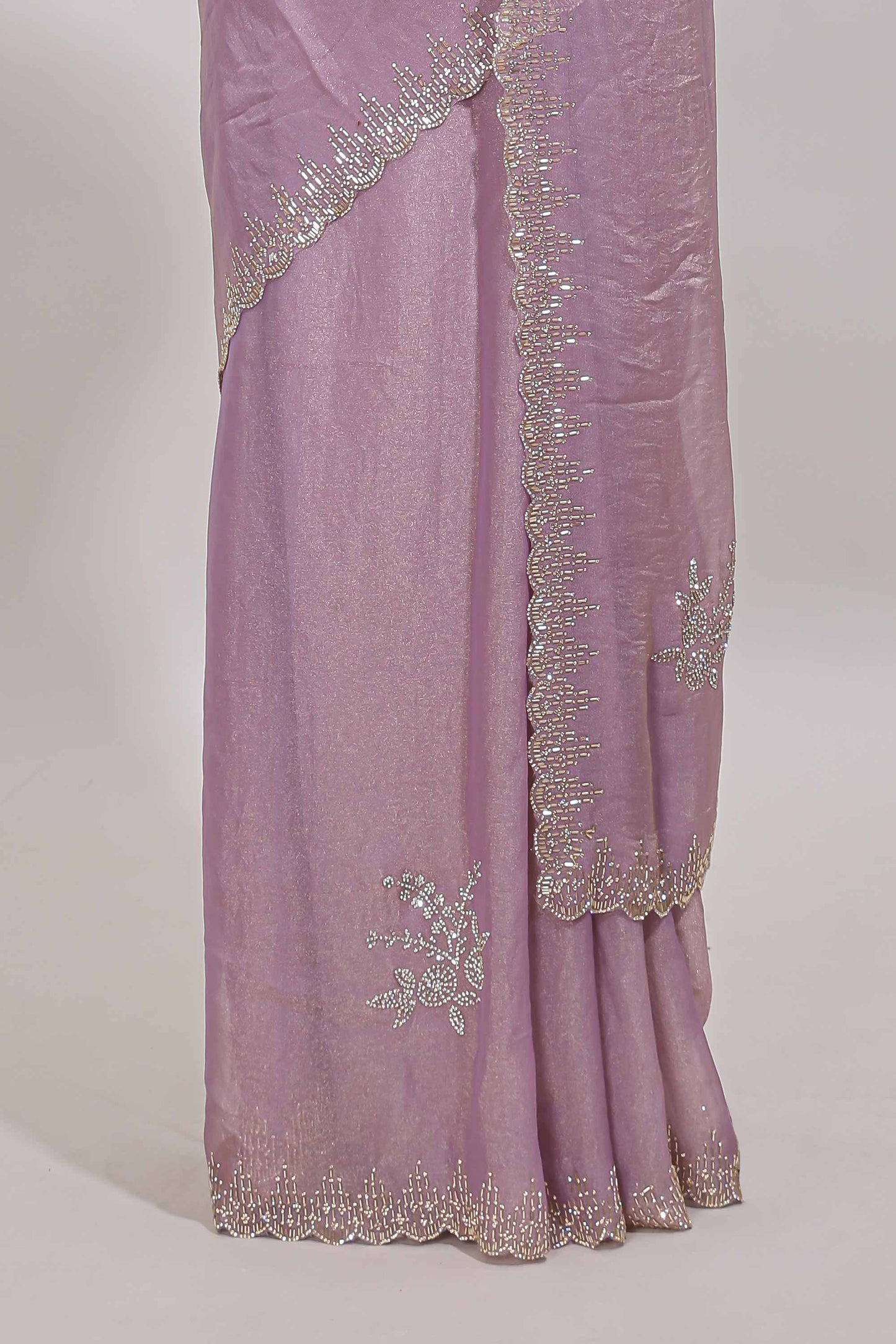 Lavender designer saree with floral motifs, stone work & scallop border