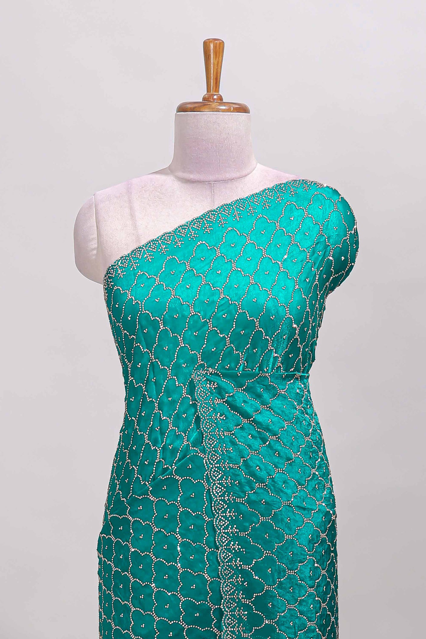Green geometric stone work designer saree with self scallop border and matching blouse