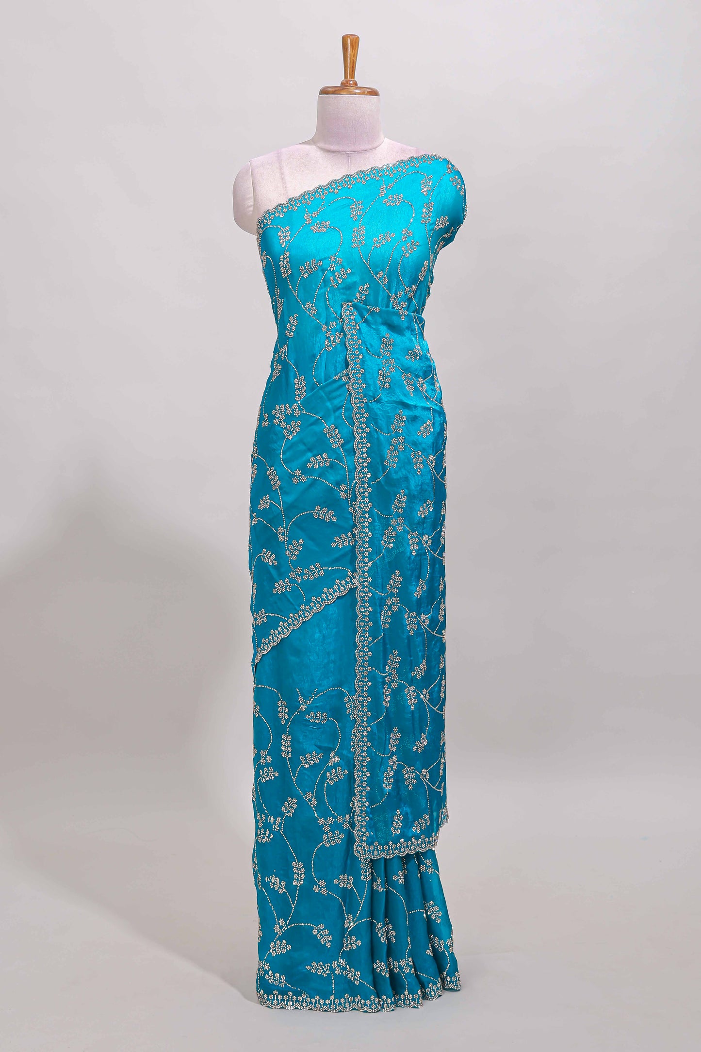 Blue floral vine stone work designer saree with self scallop border and matching blouse