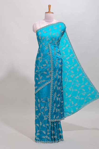 Blue floral vine stone work designer saree with self scallop border and matching blouse