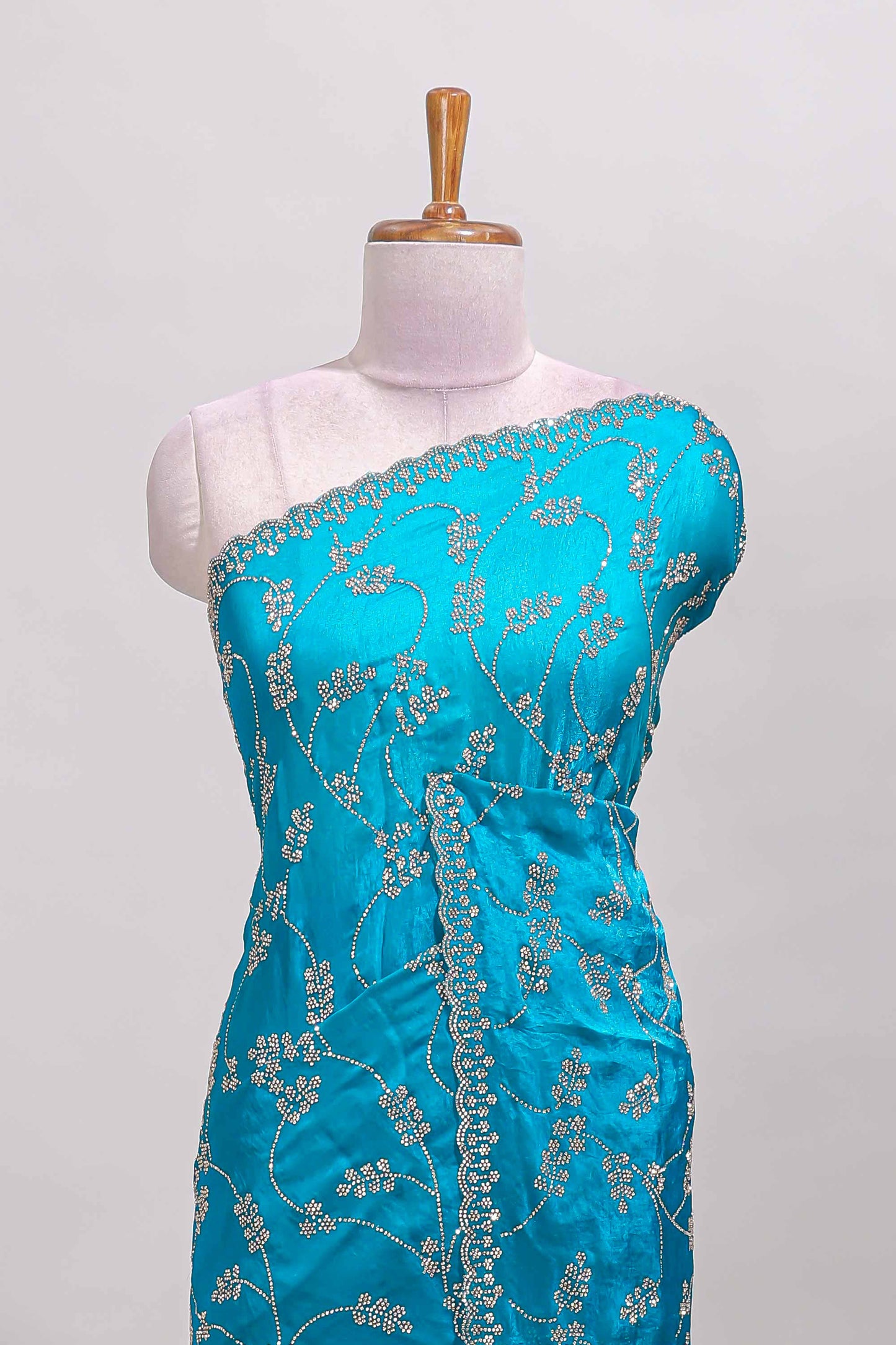 Blue floral vine stone work designer saree with self scallop border and matching blouse