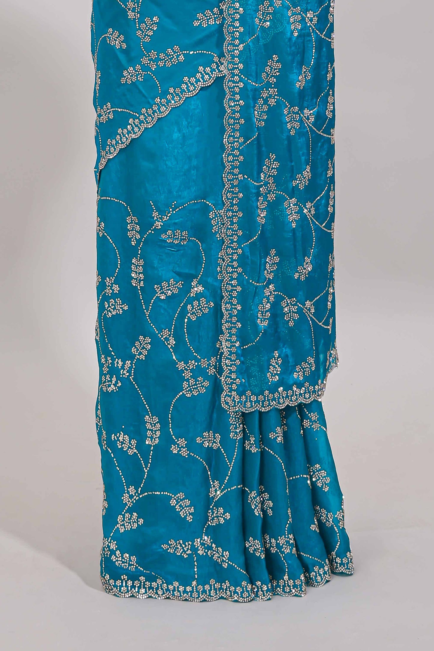 Blue floral vine stone work designer saree with self scallop border and matching blouse