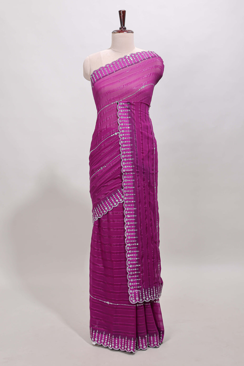 Dark magenta striped design stone work designer saree with self floral scallop border and matching blouse