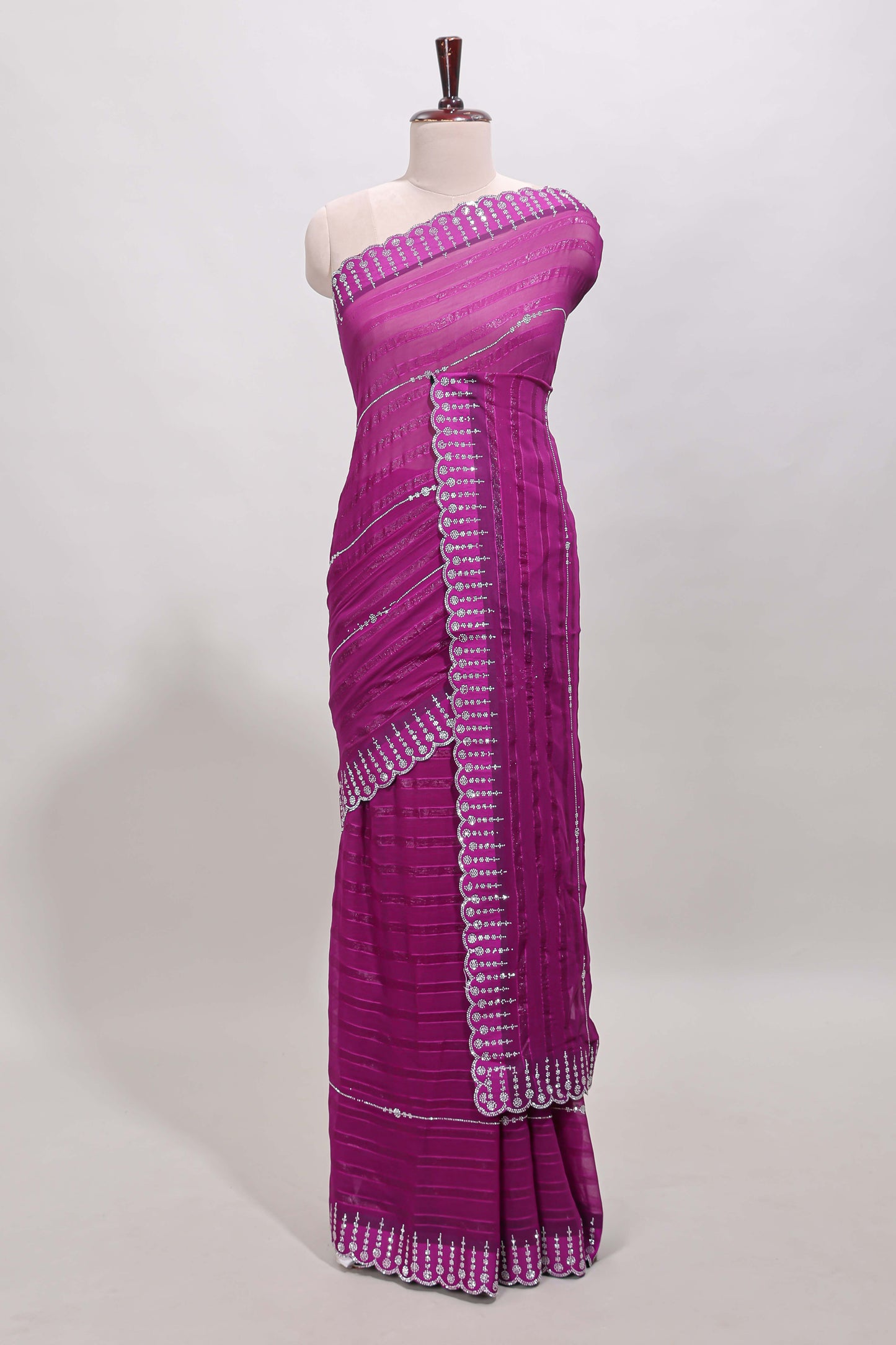Dark magenta striped design stone work designer saree with self floral scallop border and matching blouse