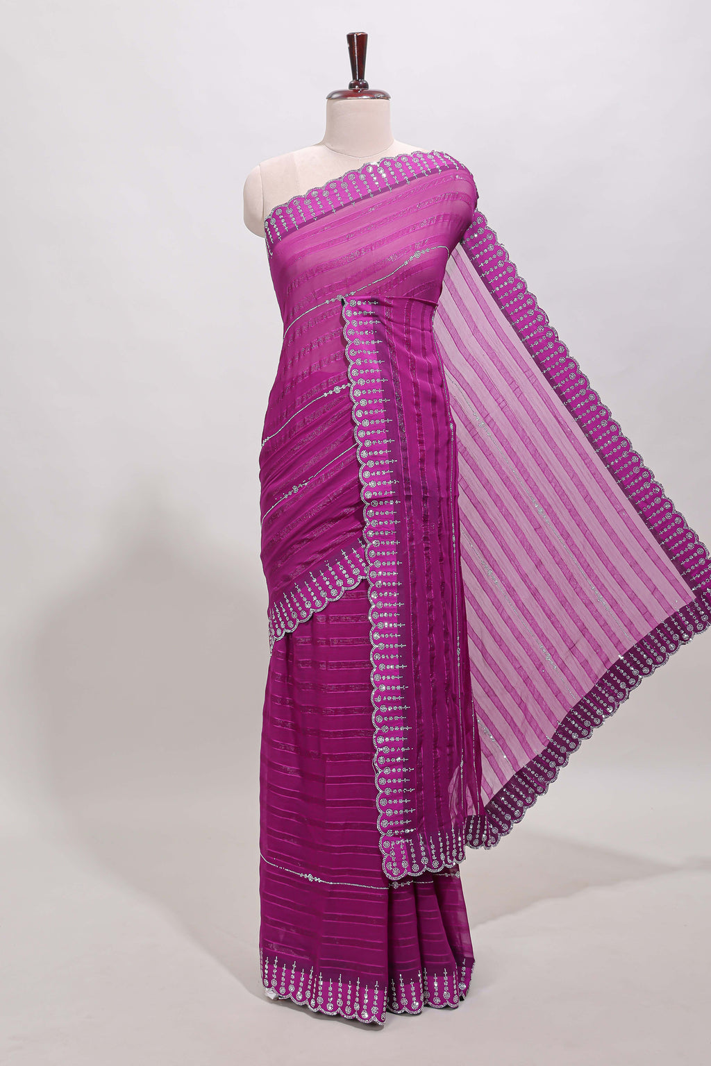 Dark magenta striped design stone work designer saree with self floral scallop border and matching blouse