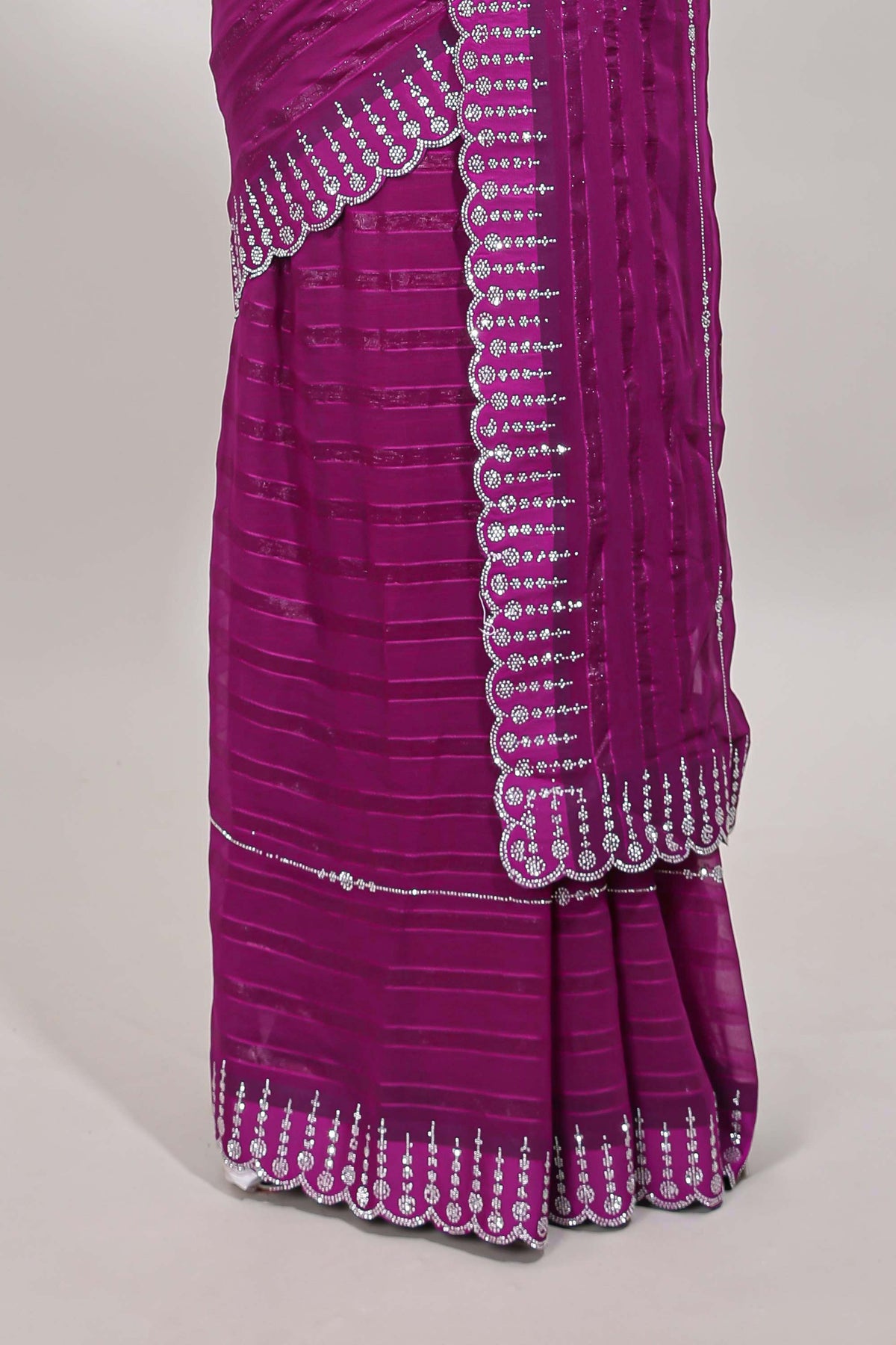 Dark magenta striped design stone work designer saree with self floral scallop border and matching blouse