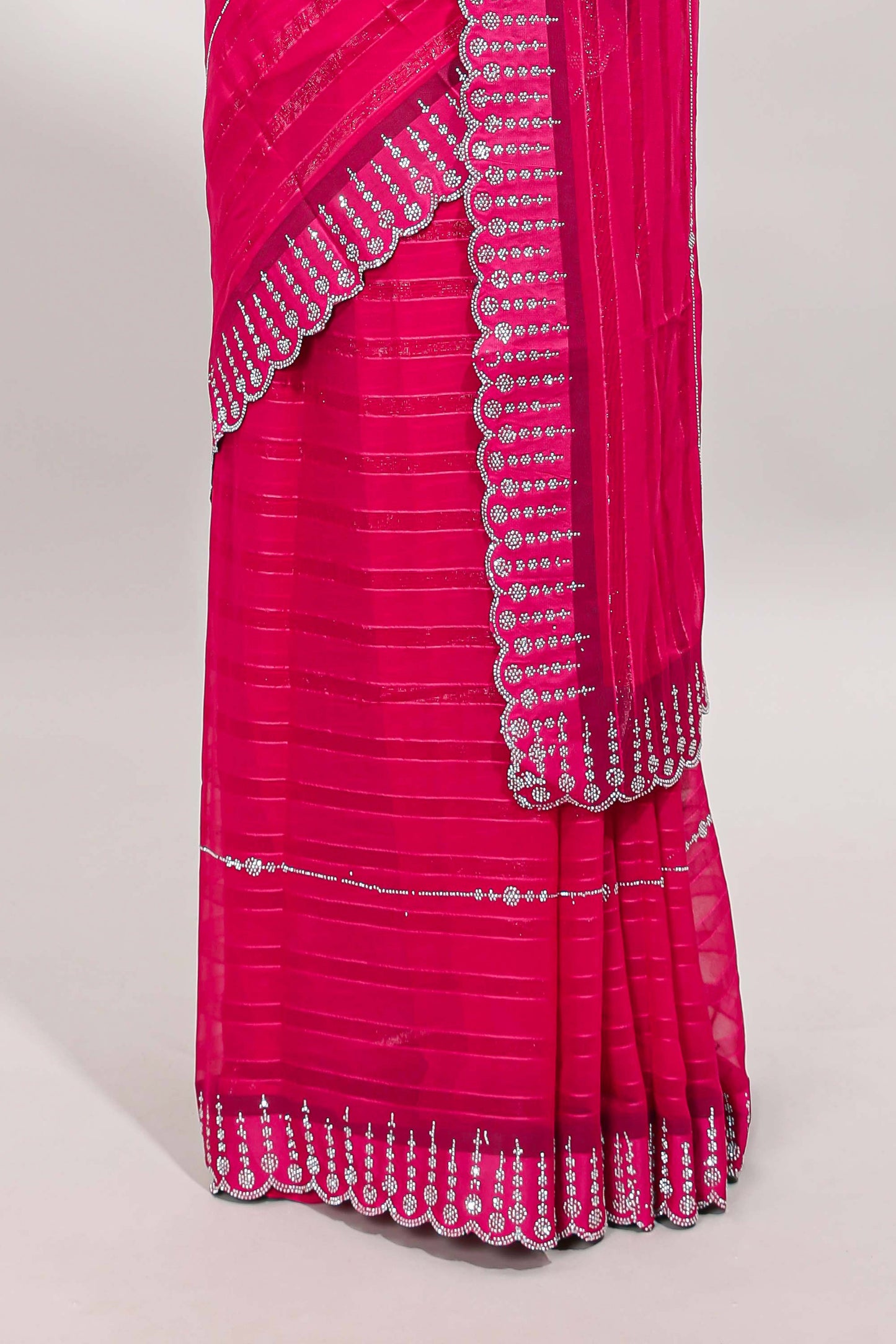 Pink striped design stone work designer saree with self floral scallop border and matching blouse