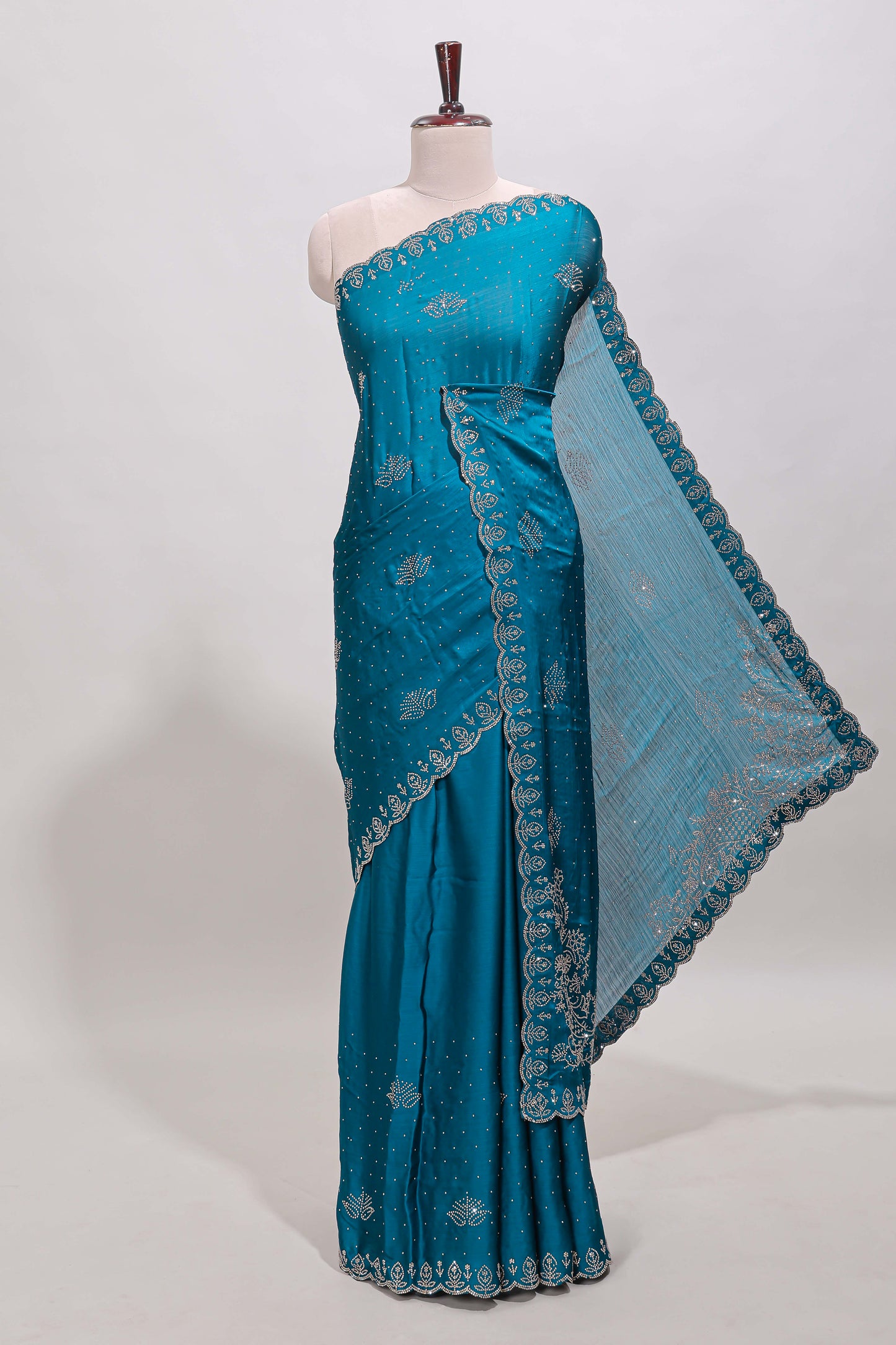 Midight green floral motifs design stone work designer saree with self floral scallop border and matching blouse