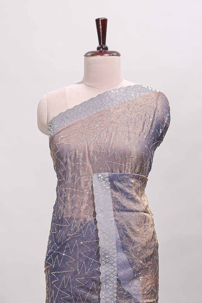 Grey geometric design stone work designer saree with self scallop border and matching blouse