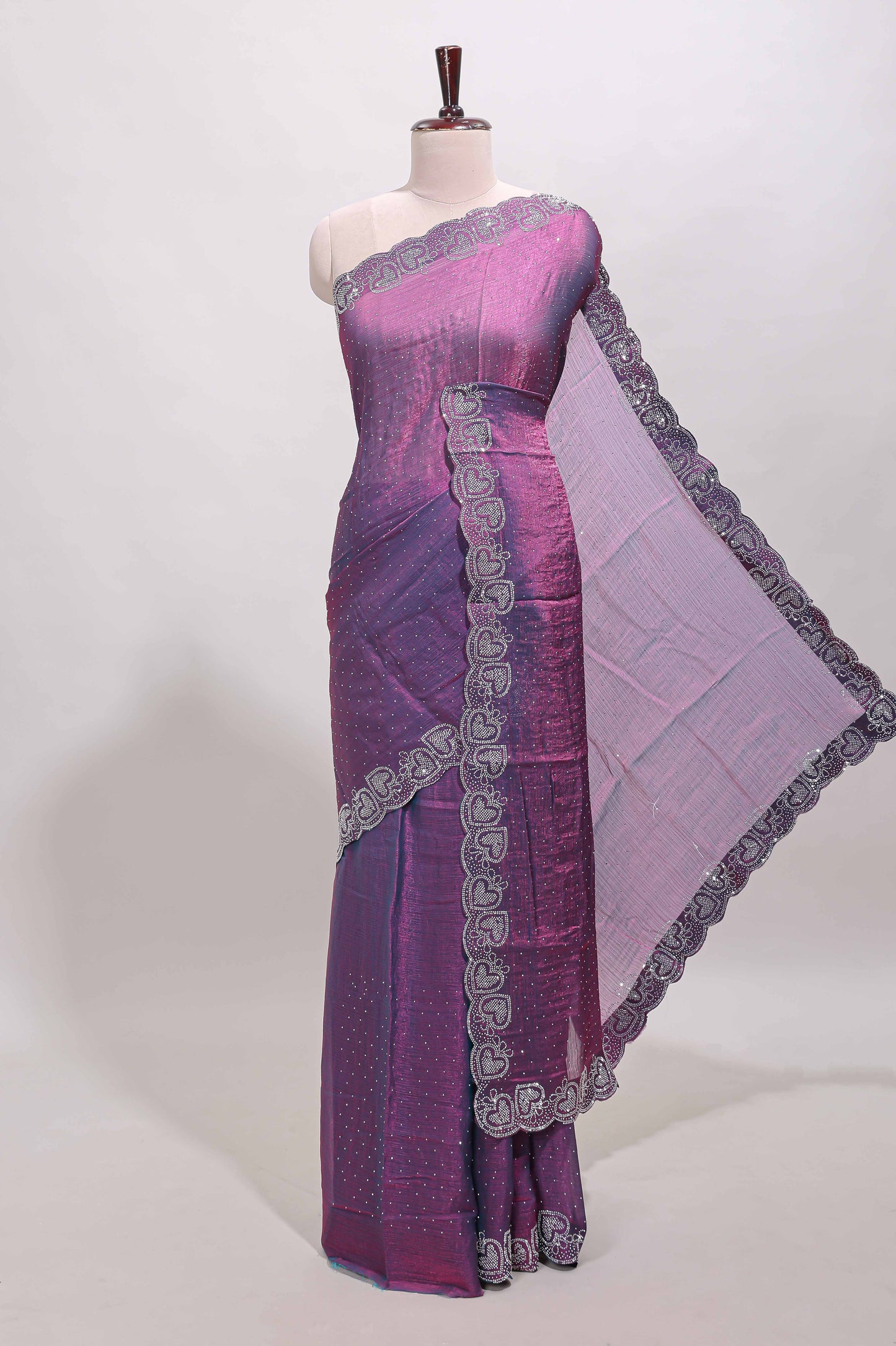 Puple stone work designer saree with self heartin design scallop border and matching blouse
