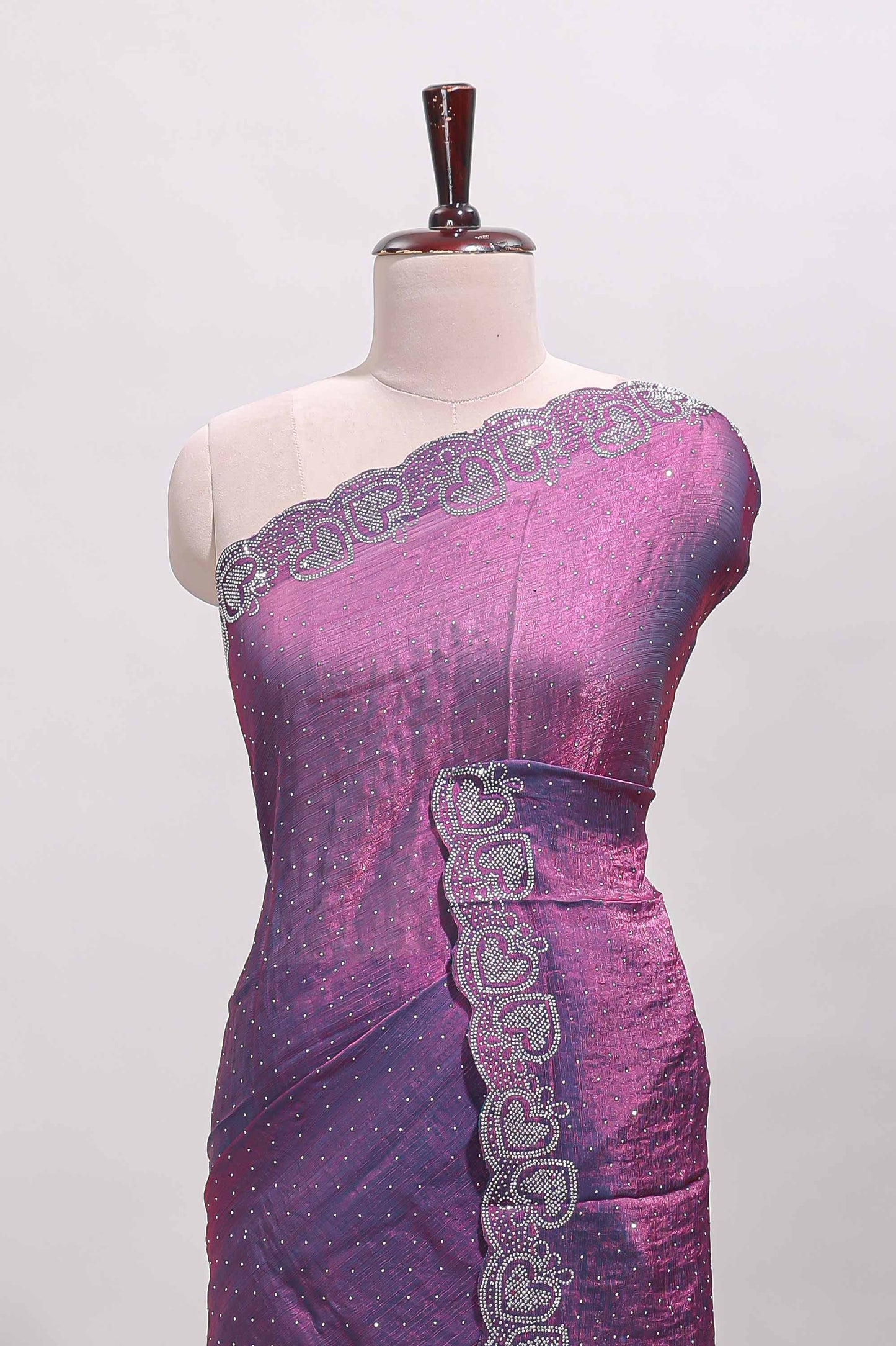 Puple stone work designer saree with self heartin design scallop border and matching blouse