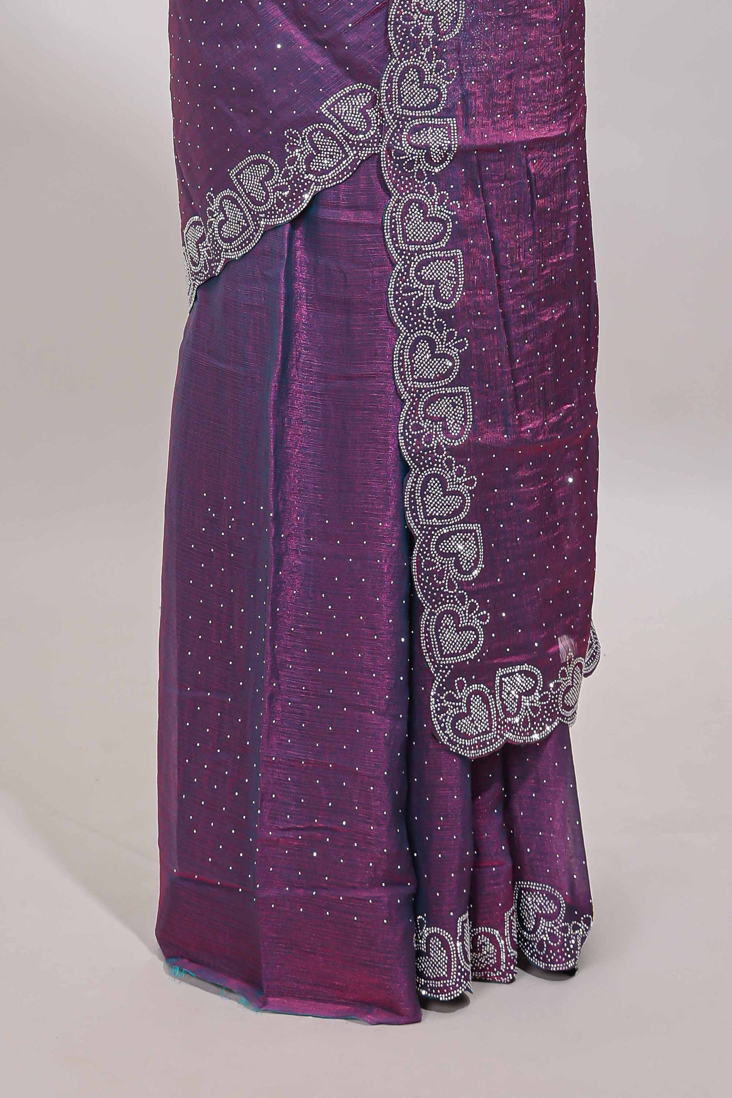 Puple stone work designer saree with self heartin design scallop border and matching blouse