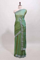 Green stone work designer saree with self heartin design scallop border and matching blouse