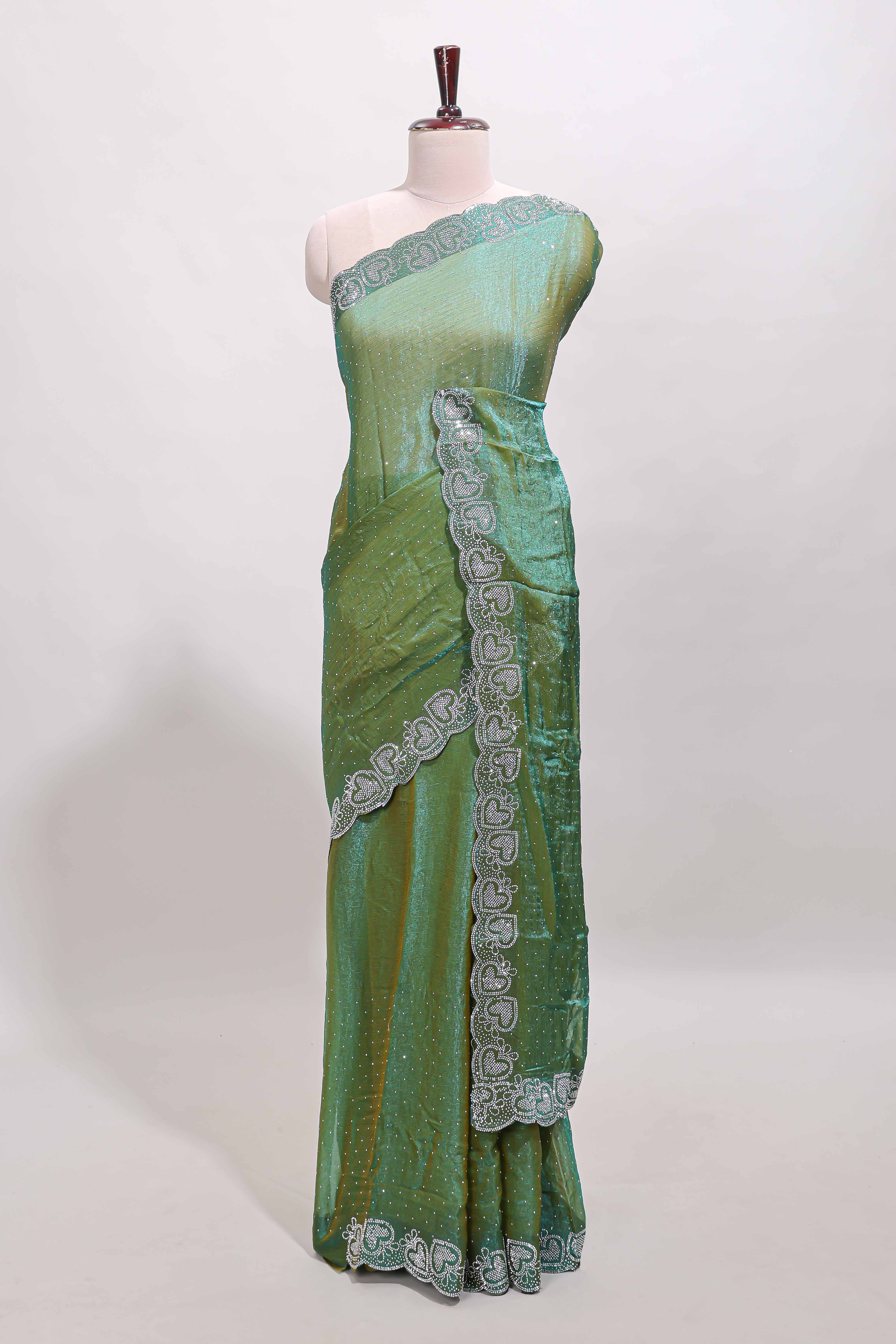Green stone work designer saree with self heartin design scallop border and matching blouse