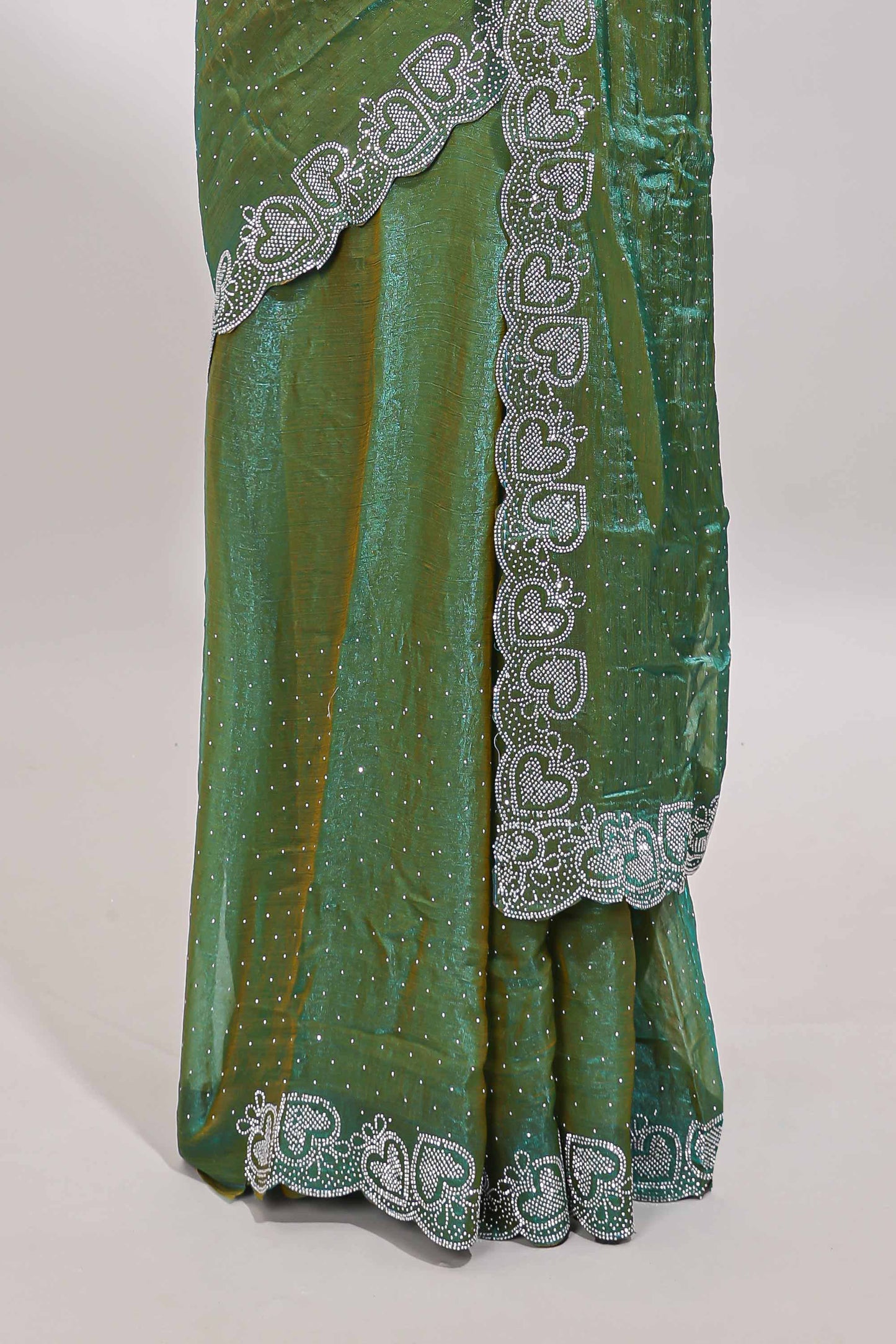Green stone work designer saree with self heartin design scallop border and matching blouse