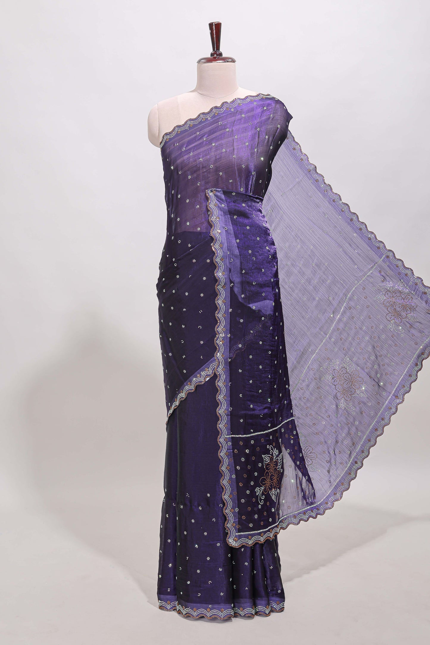 Violet stone work floral motifs designer saree with self design scallop border and matching blouse