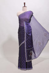 Violet stone work floral motifs designer saree with self design scallop border and matching blouse