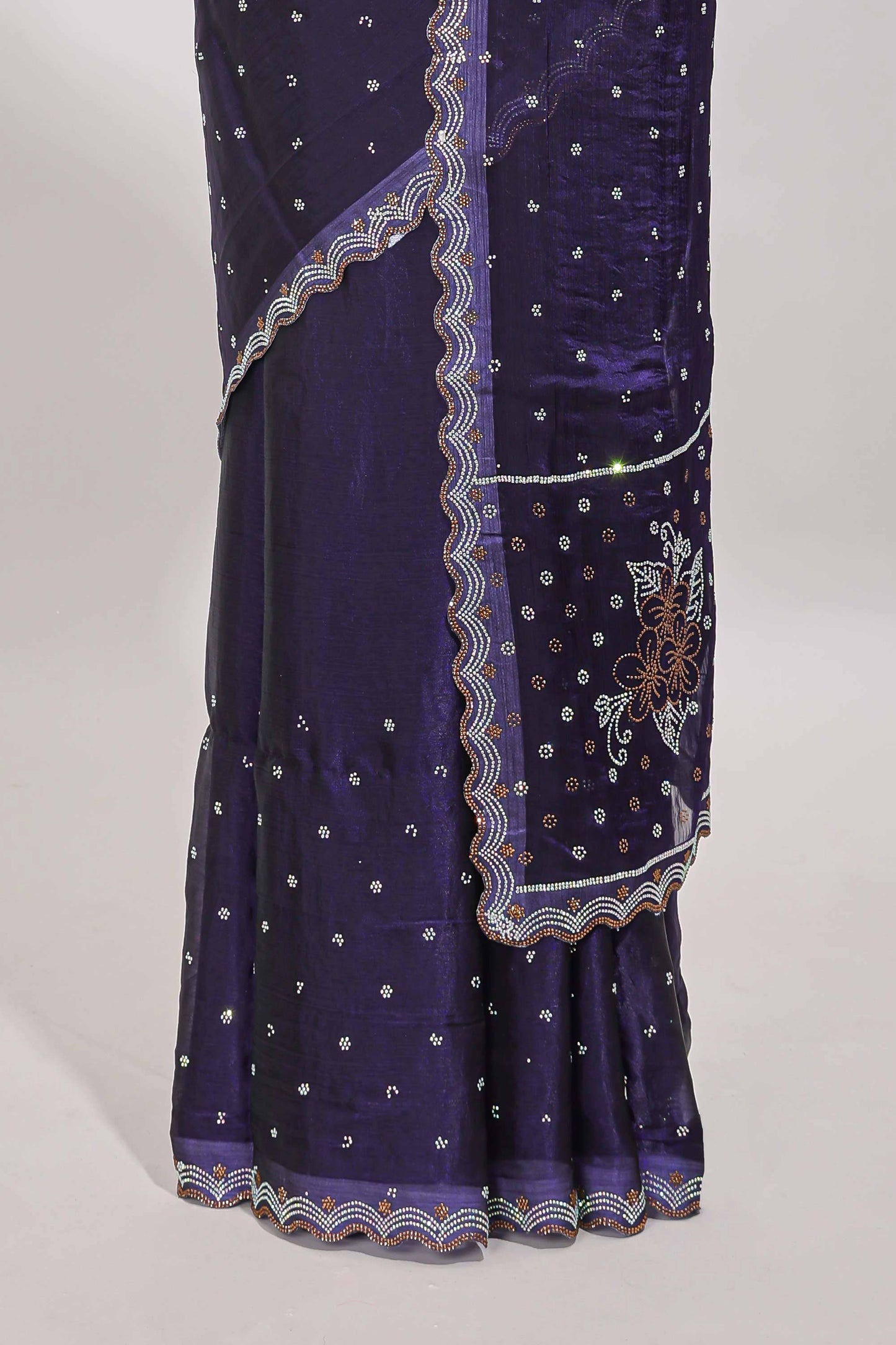 Violet stone work floral motifs designer saree with self design scallop border and matching blouse