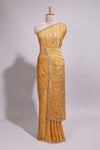 Mustard yellow saree with elegant sequin embellishments and a shimmering border along with matching blouse