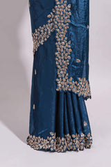 Royal blue saree with elegant golden floral embroidery and a rich embellished border along with embroidered blouse piece