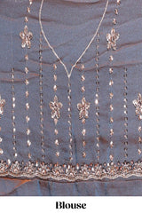 Steel blue saree with silver sequin floral motifs vertical stripe detailing and an embellished border along with blouse