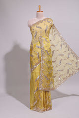 Lemon yellow saree with silver sequin abstract embroidery floral motifs and a shimmering embellished border along with matching blouse