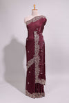 Deep wine saree with elegant golden floral embroidery and a rich embellished border along with matching blouse