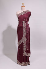 Deep wine saree with elegant golden floral embroidery and a rich embellished border along with matching blouse