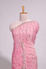 Baby pink saree with silver sequin wavy line embroidery floral motifs and a sparkling embellished border along with matching blouse