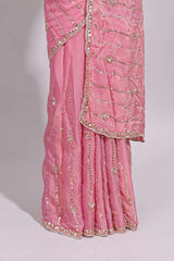 Baby pink saree with silver sequin wavy line embroidery floral motifs and a sparkling embellished border along with matching blouse