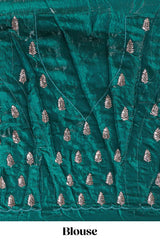 Bottle green saree with elegant golden floral embroidery and a rich embellished border along with matching blouse