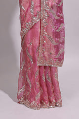 Dusty pink saree with sequin abstract wave embroidery and a detailed embellished border along with matching blouse