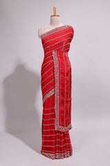 Red saree with silver sequin stripes embellished border and matching designer pallu along with blouse