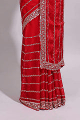 Red saree with silver sequin stripes embellished border and matching designer pallu along with blouse