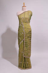 Olive green saree with silver sequin vertical lines floral motifs embellished border and matching pallu design along with matching blouse