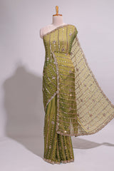 Olive green saree with silver sequin vertical lines floral motifs embellished border and matching pallu design along with matching blouse